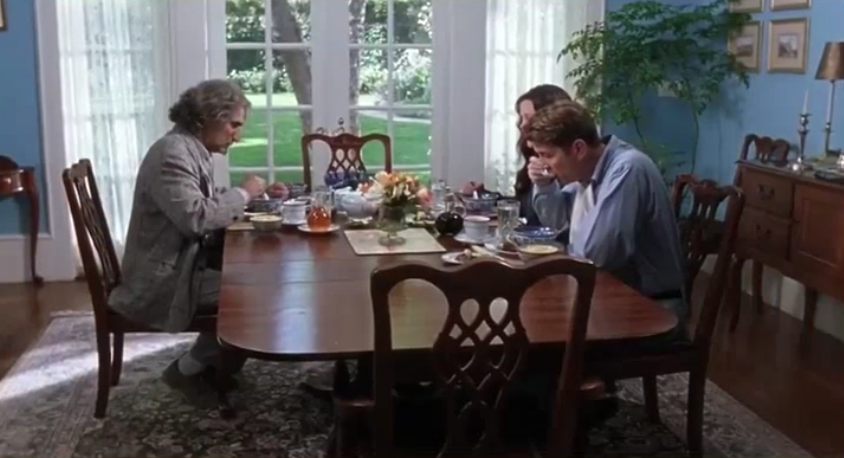 actors in movie at dinner table eating
