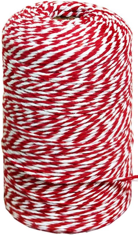 A spool of red and white twine, tightly wound, perfect for crafting a DIY Christmas gift.