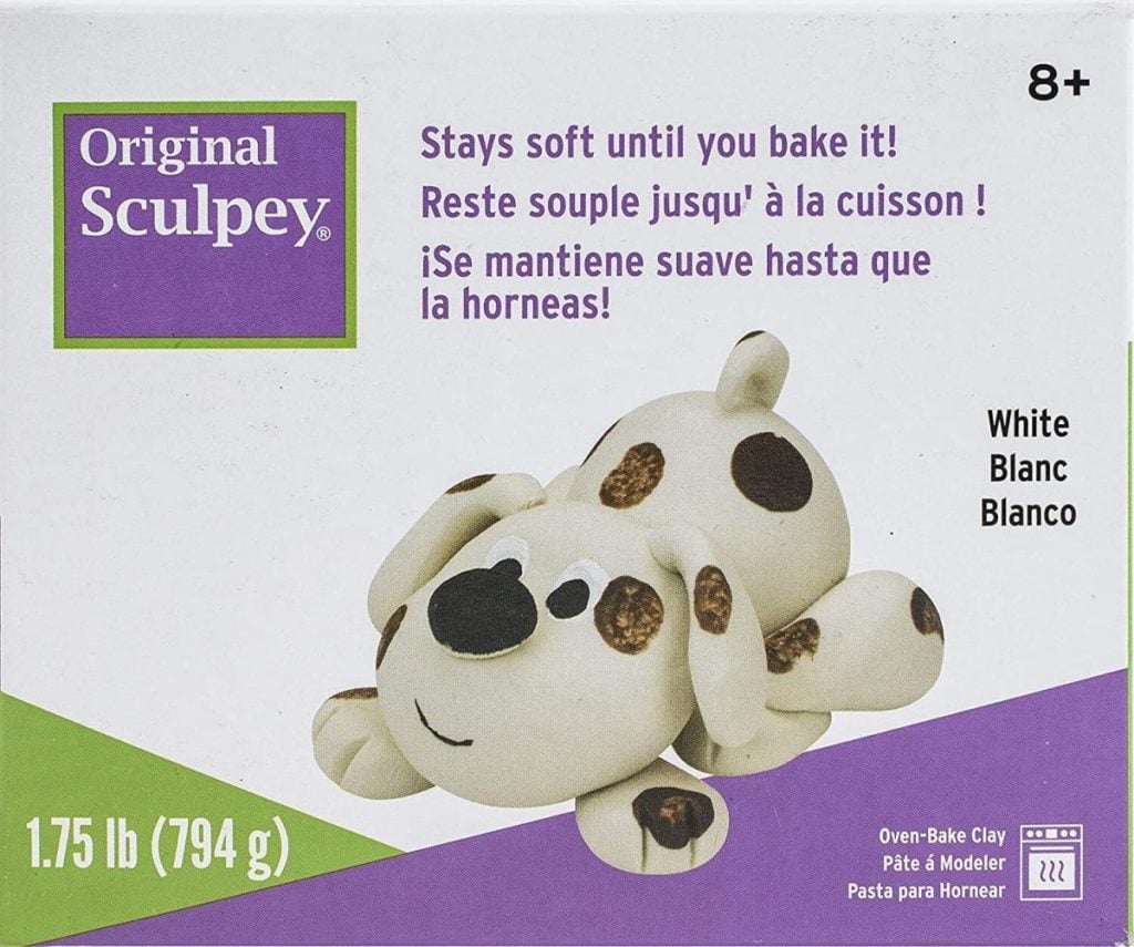 Box of Original Sculpey clay featuring a dog-shaped figurine, perfect for a DIY Christmas gift. Text reads "Stays soft until you bake it!" in English, French, and Spanish. Package shows weight: 1.75 lb (794 g).