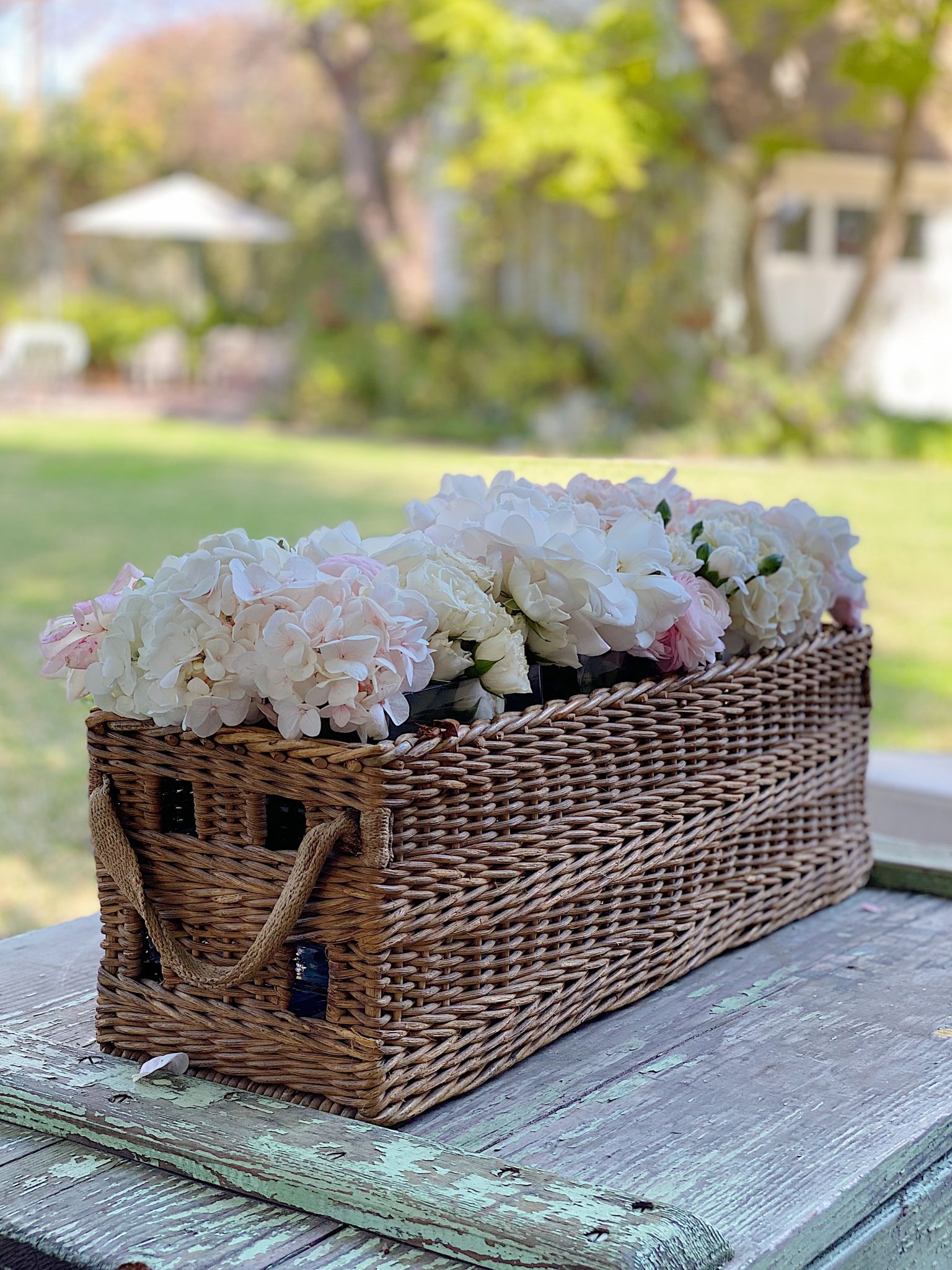 Fresh Flowers in a Basket Outside