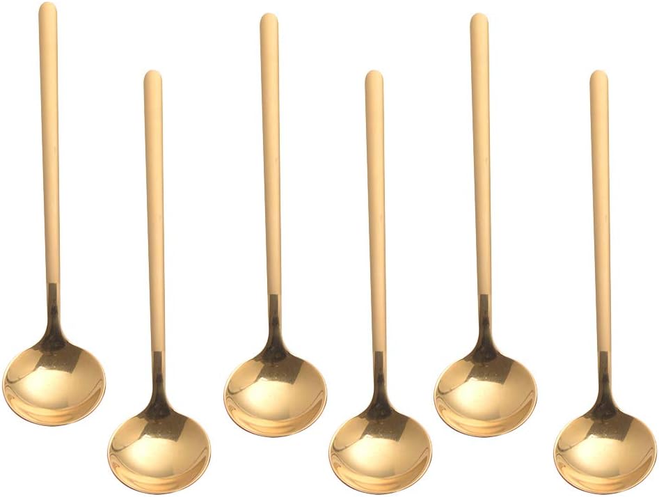 Six identical gold-colored metal spoons with long handles are arranged in two rows of three on a white background—perfect for serving your favorite Dinner Party Recipes with style.