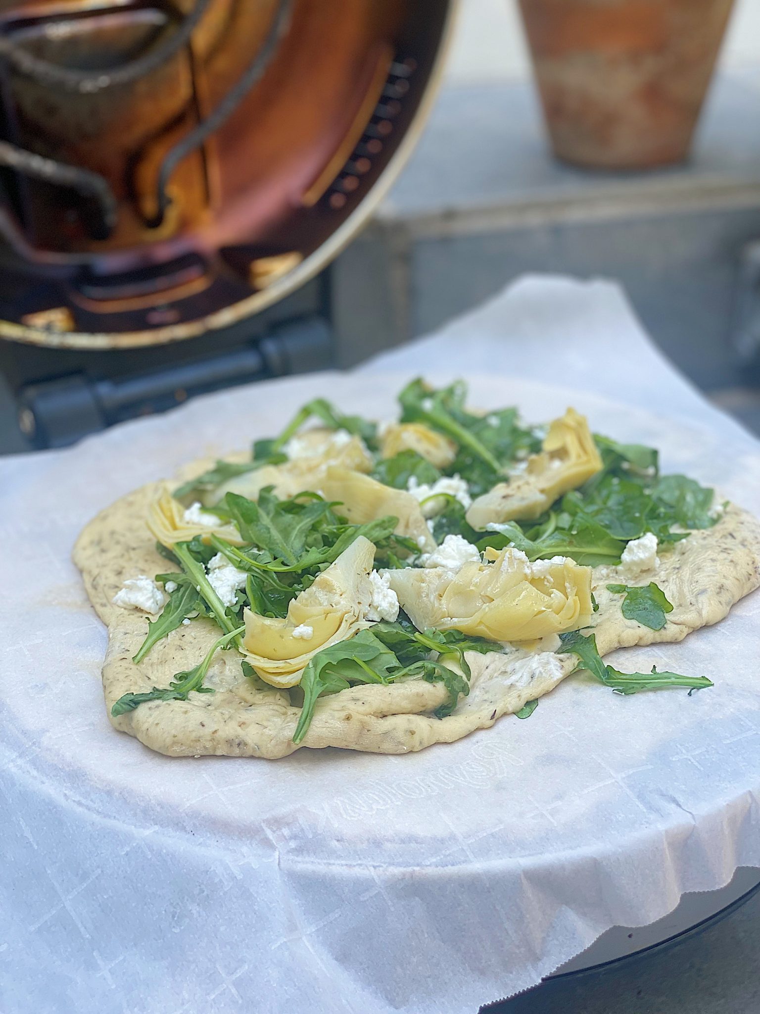 Arugula, Goat Cheese and Artichoke Pizza in the Pizza Oven