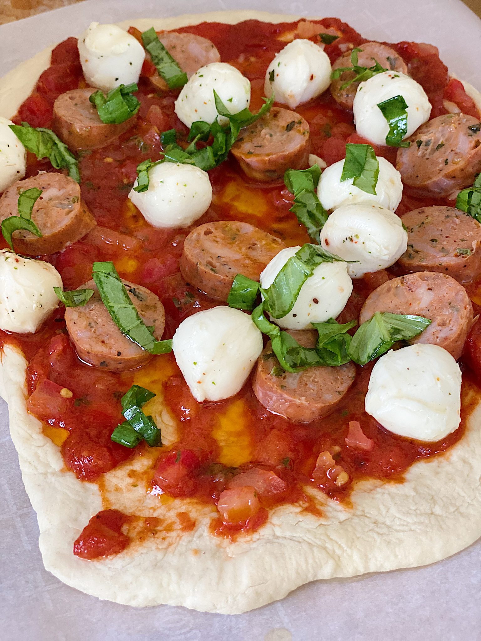 Sausage, Basil, and Mozarella Pizza