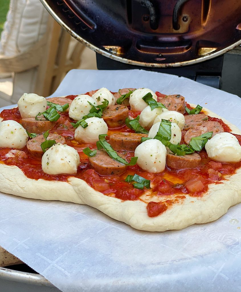 Sausage, Basil, and Mozarella Pizza in the Pizza Oven