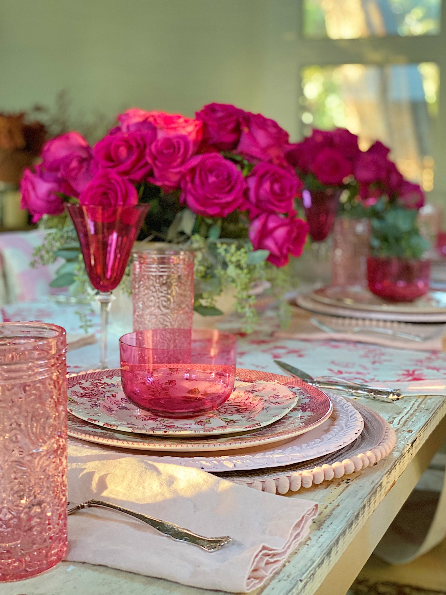 A Christmas Table with Pink Christmas Dinner Plates