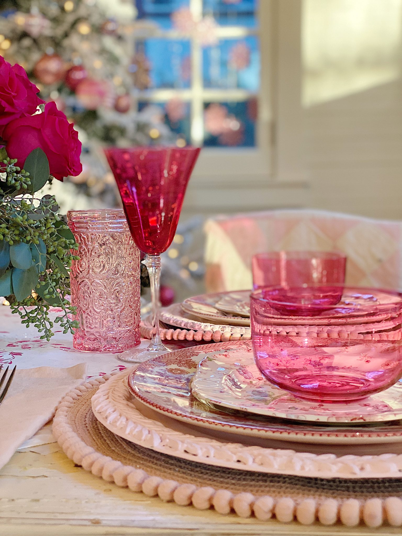 A Christmas Table with Pink Christmas Dinner Plates