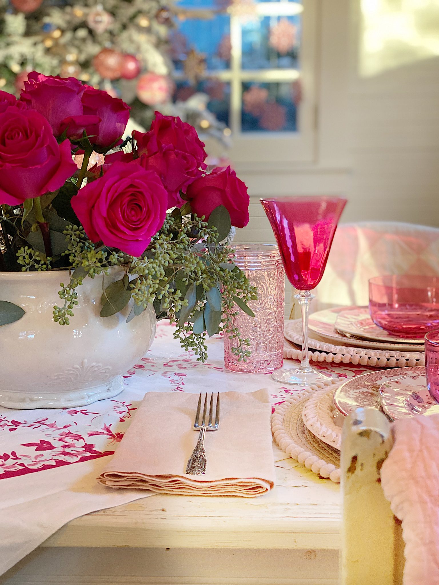 A Christmas Table with Pink Christmas Dinner Plates