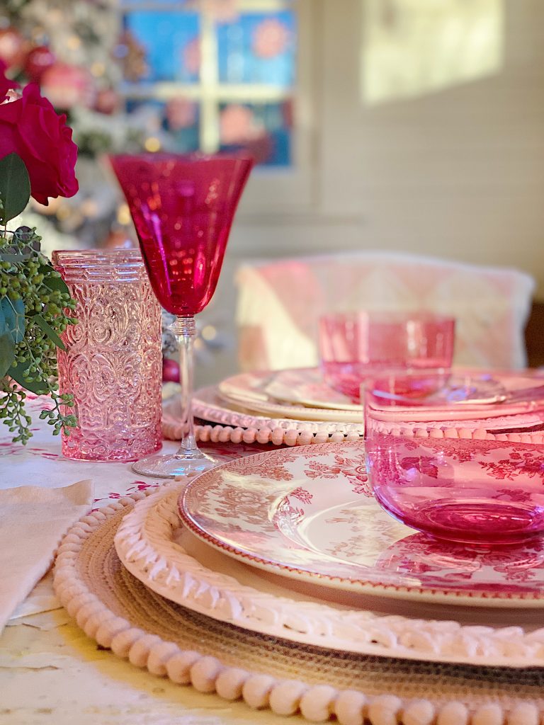 A Christmas Table with Pink Christmas Dinner Plates