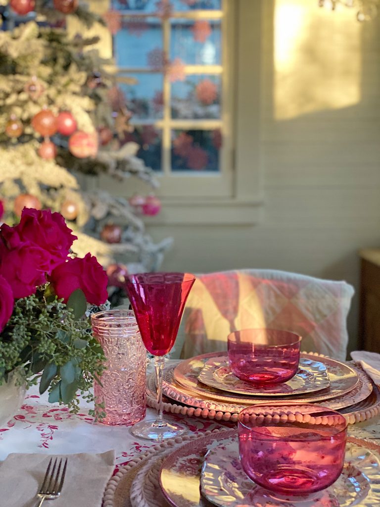 A Christmas Table with Pink Christmas Dinner Plates