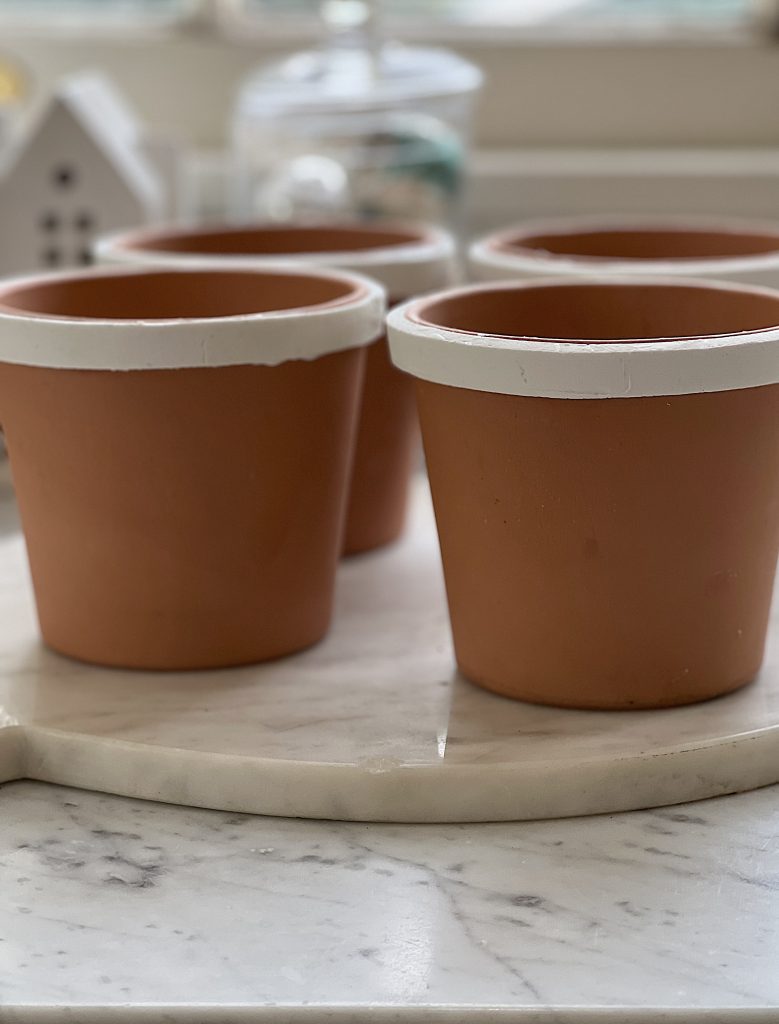 Adding clay to Painted Ceramic Pots