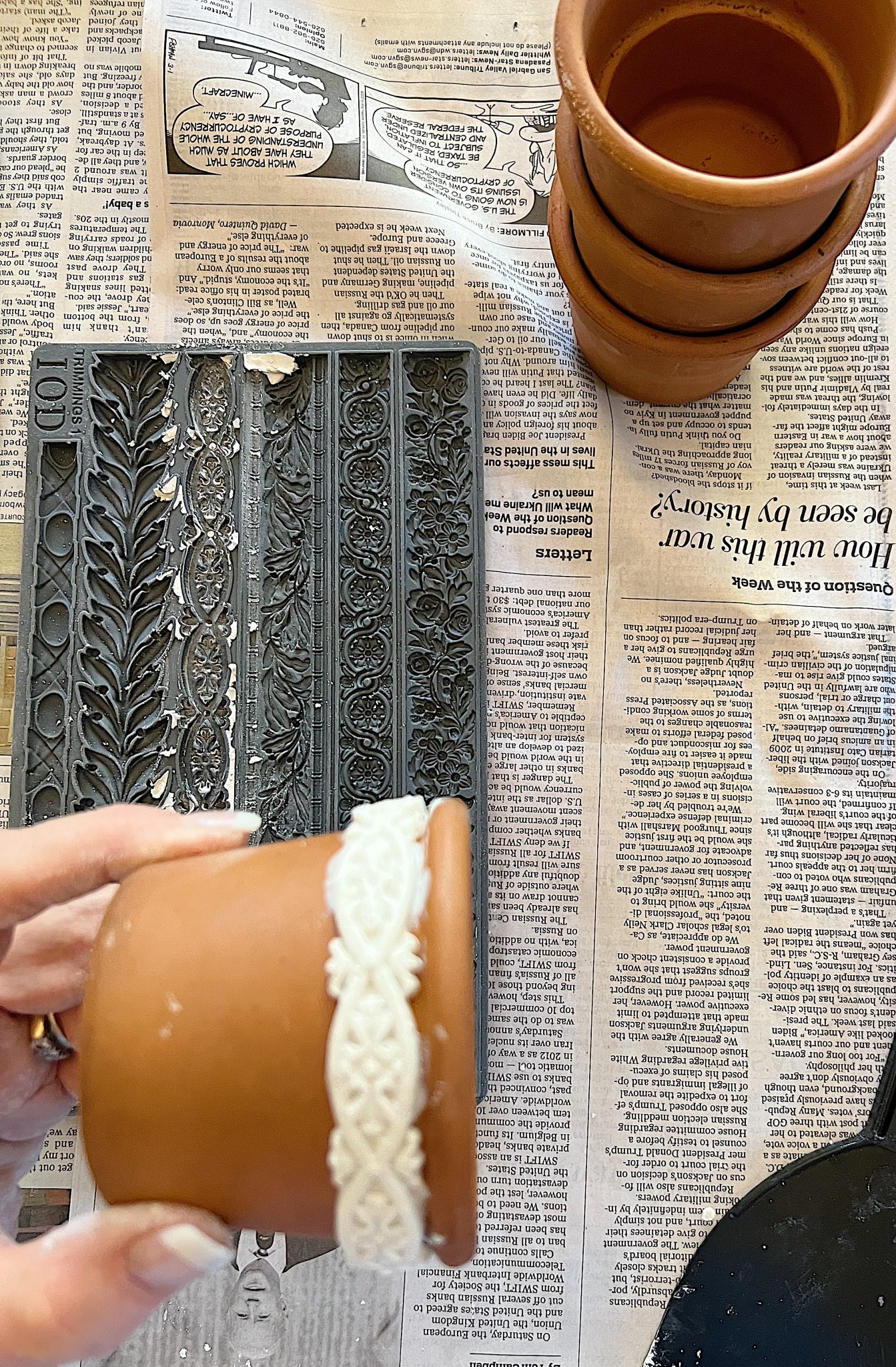 Adding clay on the Terra Cotta Pots