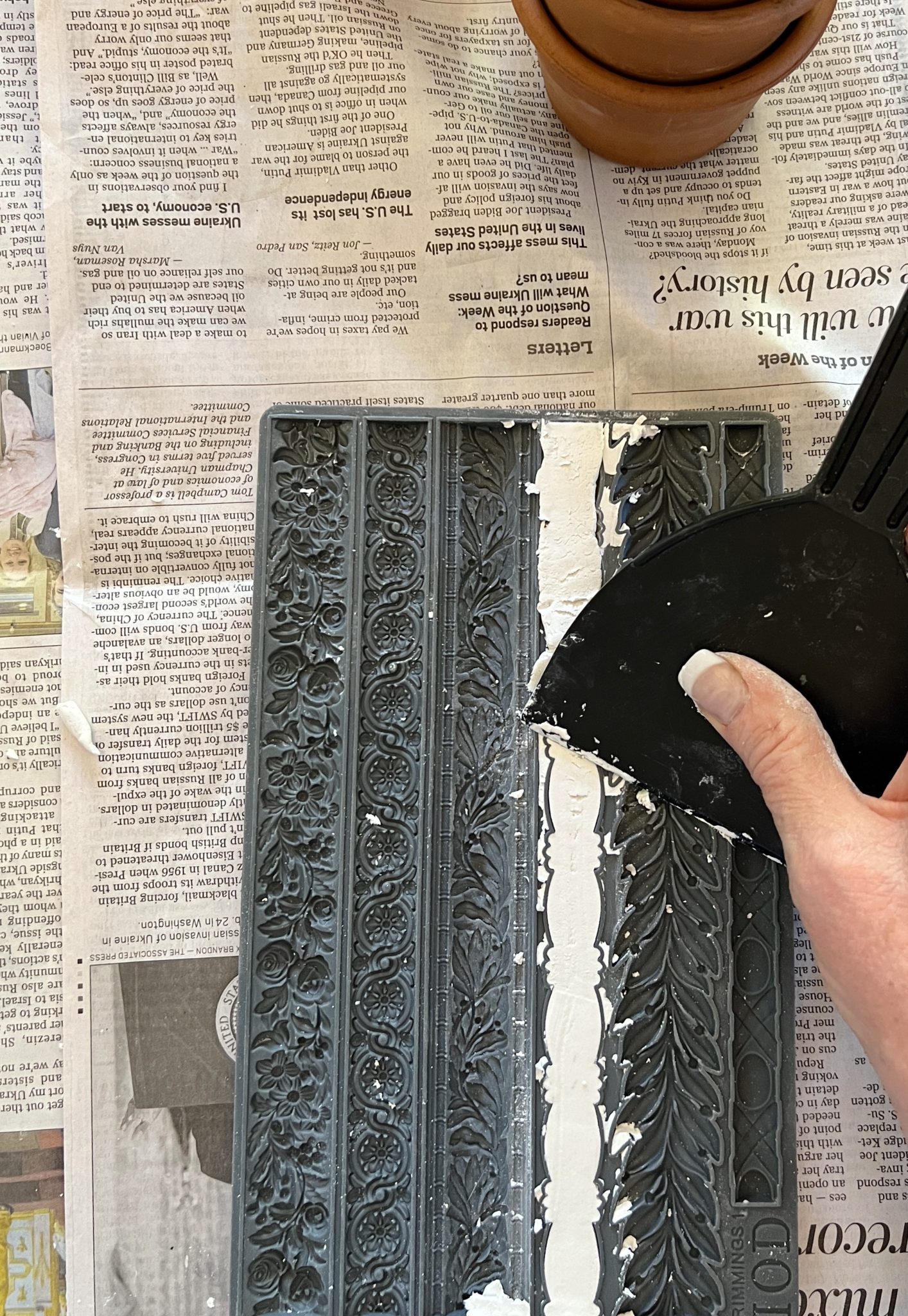 Pressing clay into the Mold