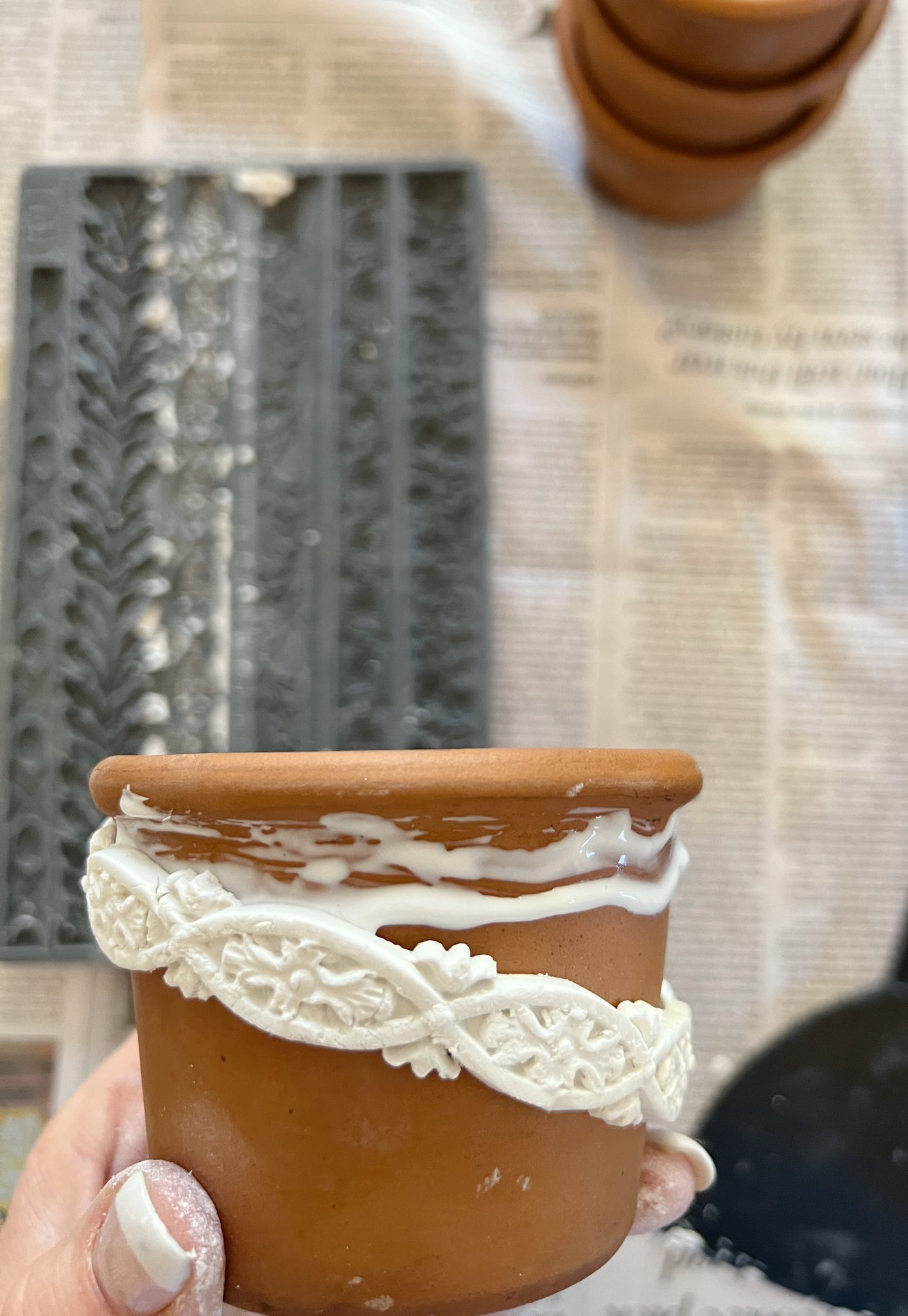 Using Glue to Attach the Clay to the Terra Cotta Pots