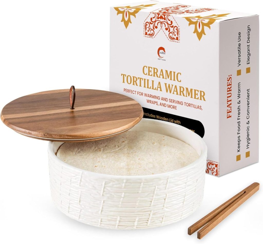 A ceramic tortilla warmer with a wooden lid and tongs is shown next to its packaging box labeled "Ceramic Tortilla Warmer"—perfect for serving warm tortillas on a happy Taco Tuesday.