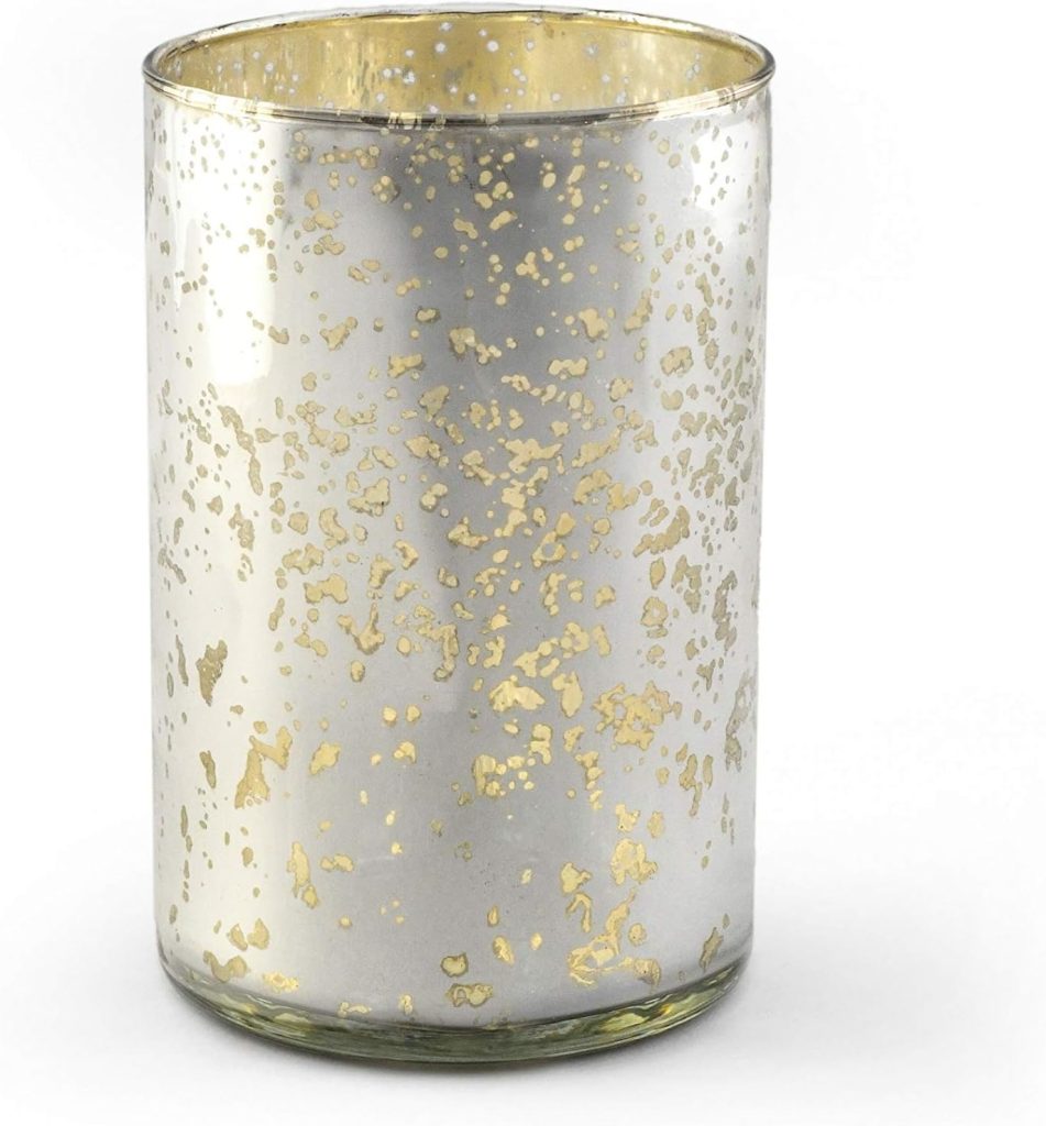 A cylindrical glass candle holder with a silver and gold speckled pattern on its surface, perfect for elevating the Art of Entertaining, set against a plain white background.