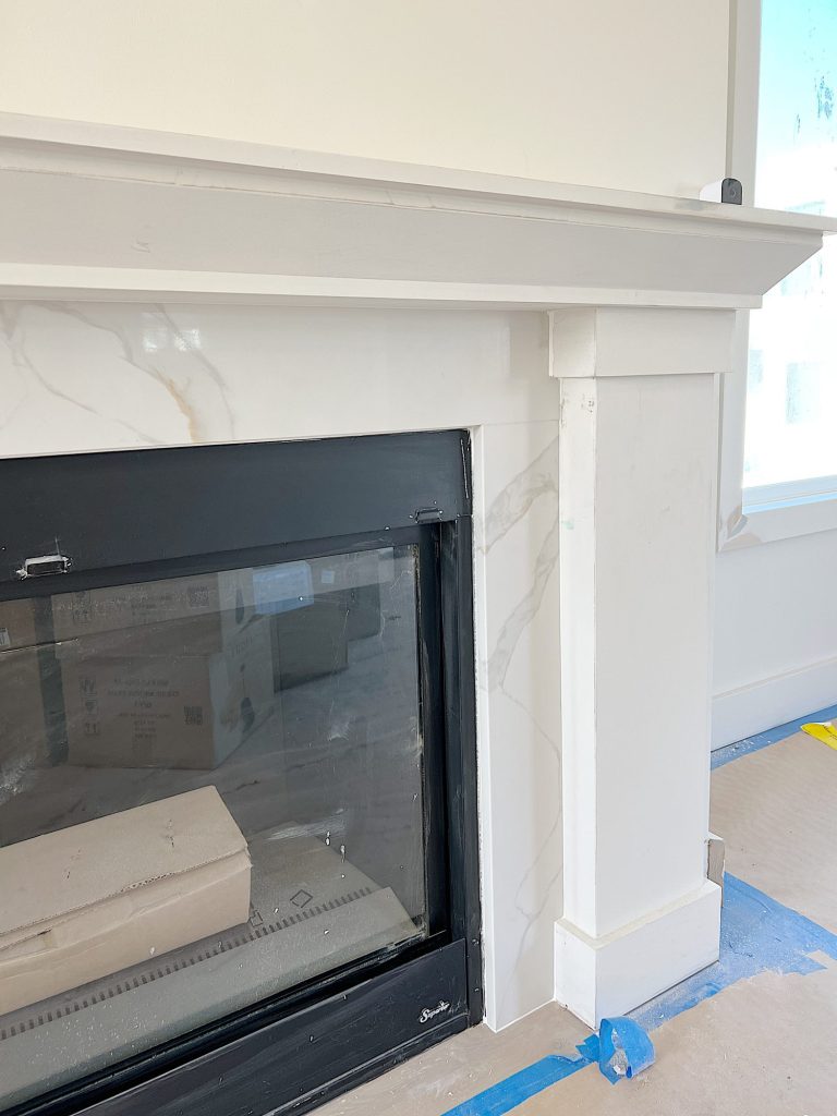 fireplace mantle with quarts surround