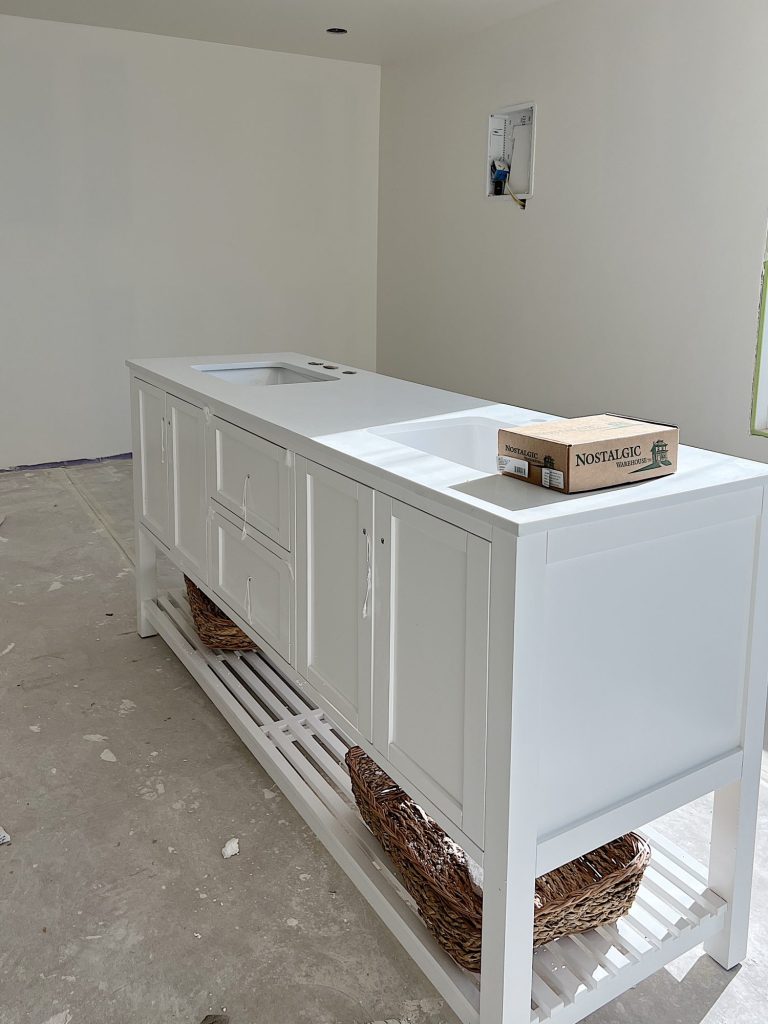 large bathroom vanity sitting in a room while house is under construction