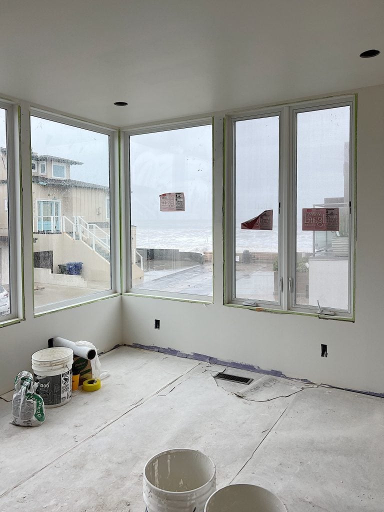 Primary Bedroom with big windows and ocean view
