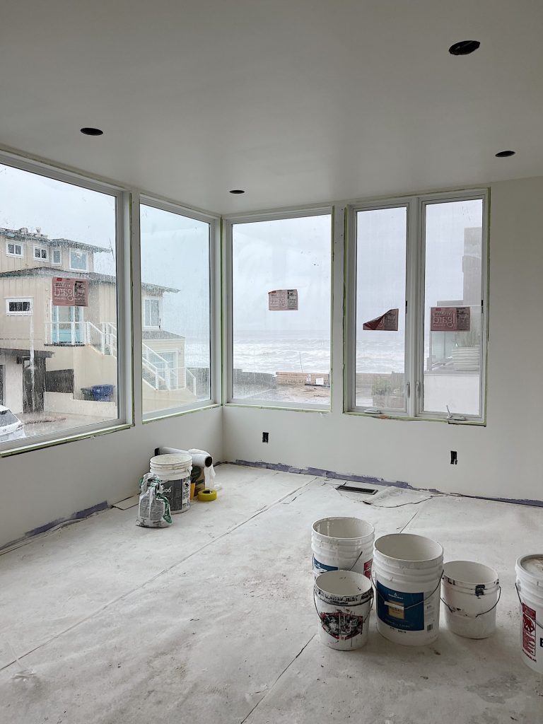 Primary Bedroom with big windows and ocean view