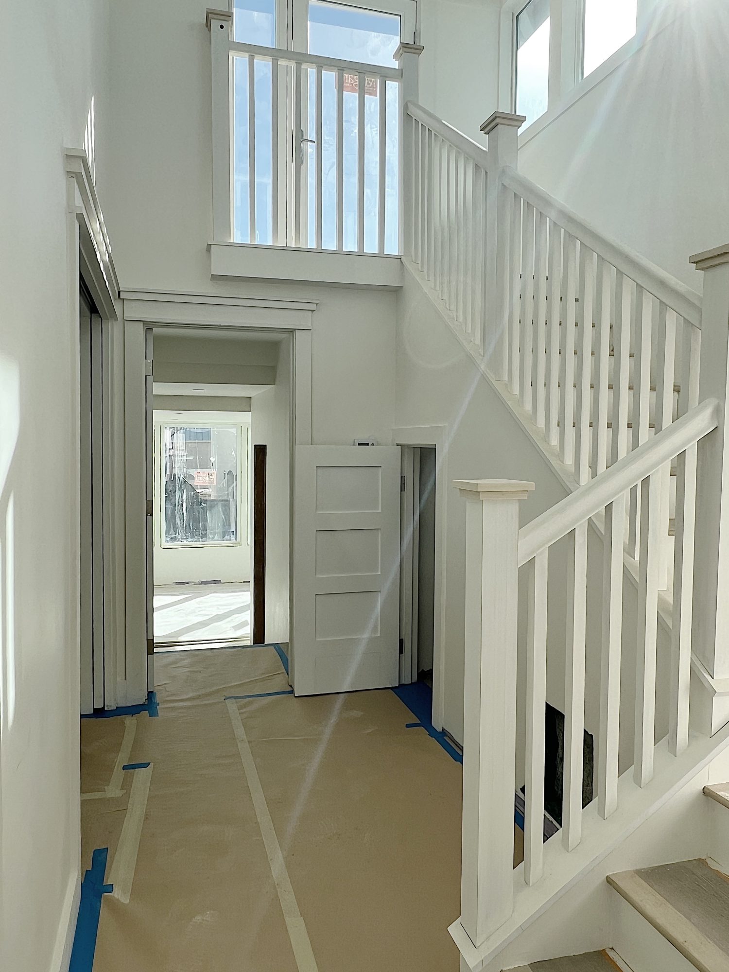 foyer are with new staircase to the 3rd floor and view of primary suite