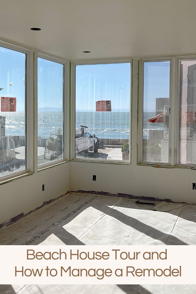 view of the ocean looking through the windows in the primary suite bedroom