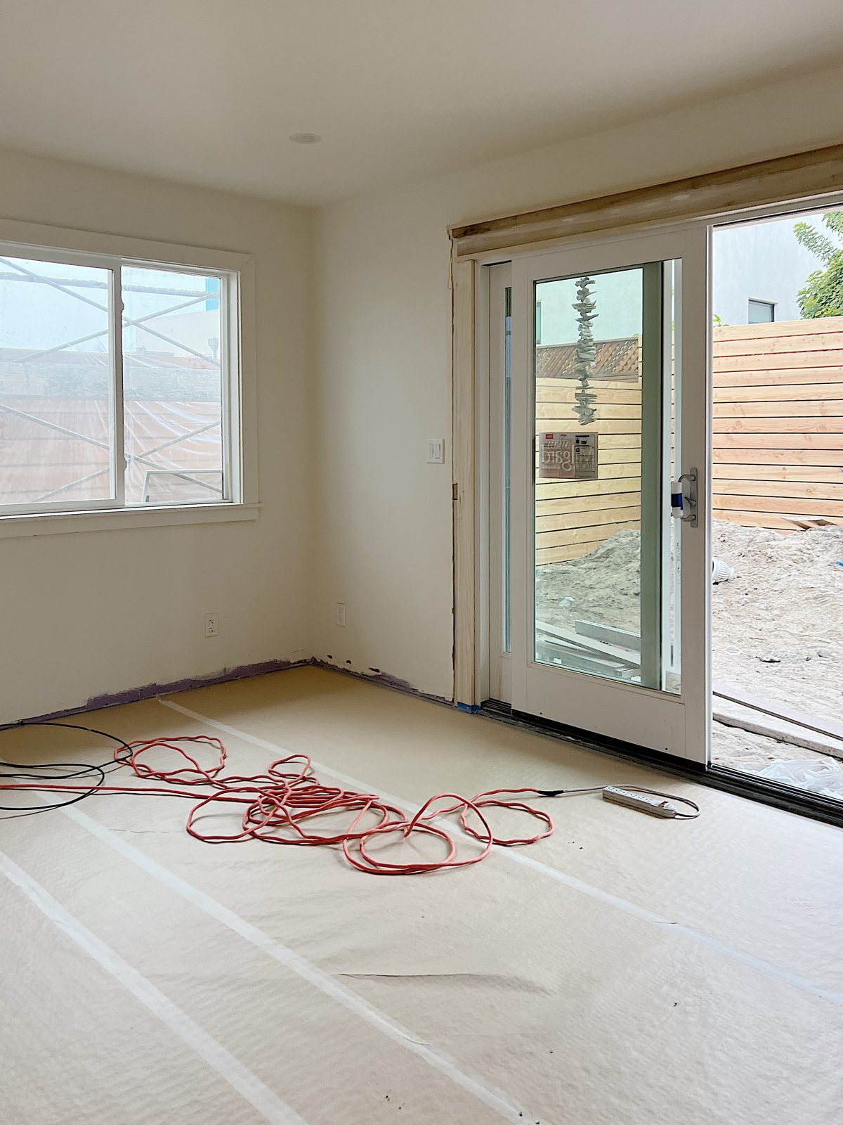 beach house room under construction with slidining glass door and window