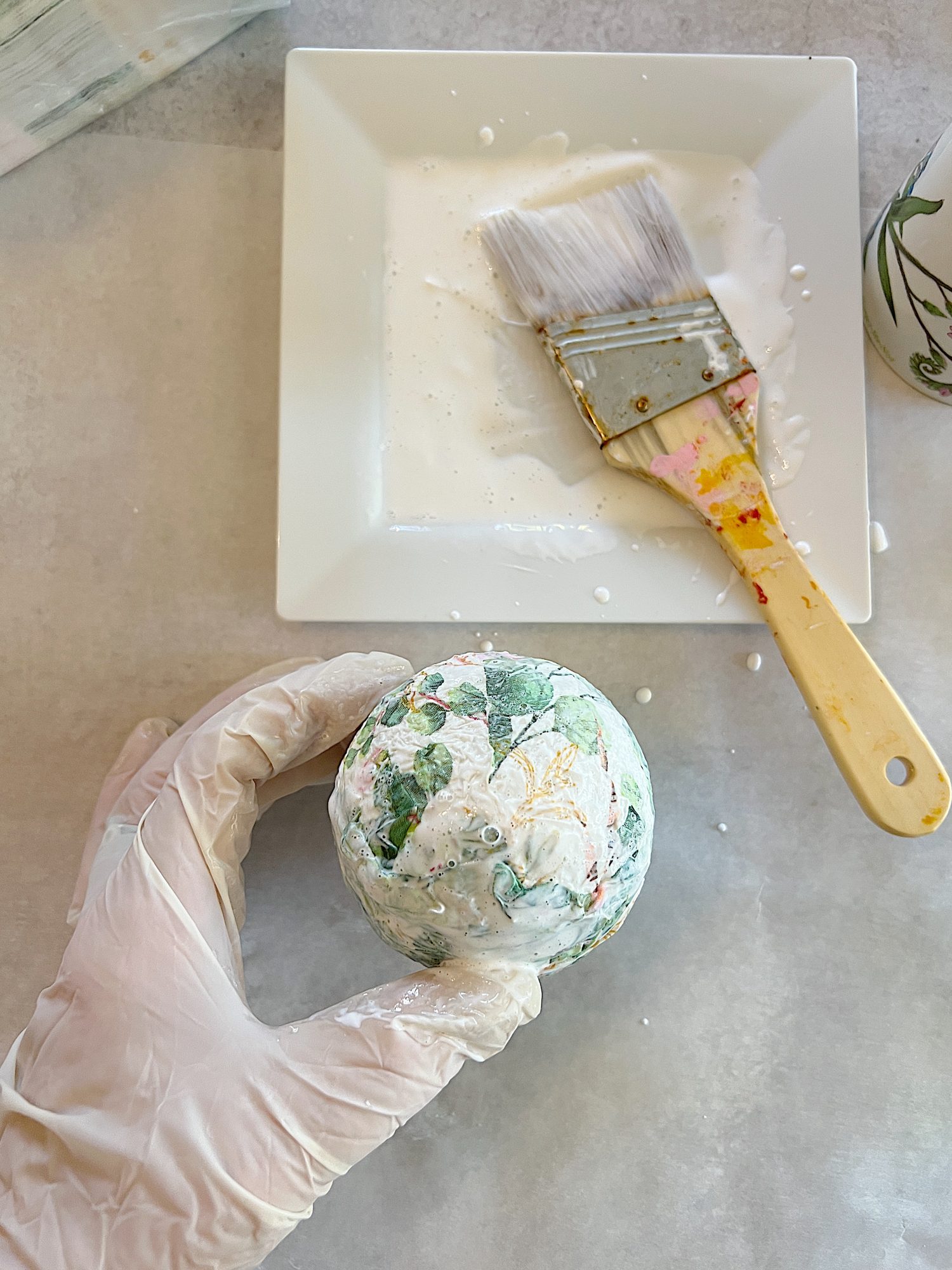 decor balls made from paper napkin with green eucalyptus design and small styrofoam balls