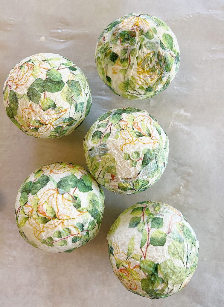 decor balls made from paper napkin with green eucalyptus design and small styrofoam balls