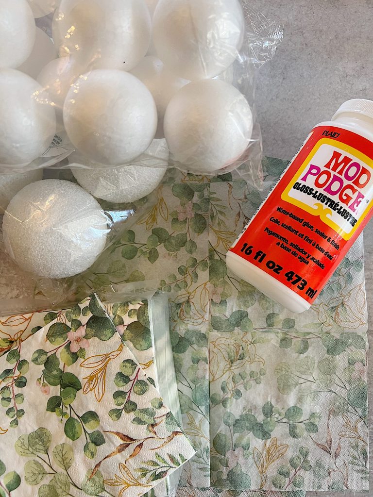 styrofoam balls, paper napkins with green eucalyptus design, and mod podge glue