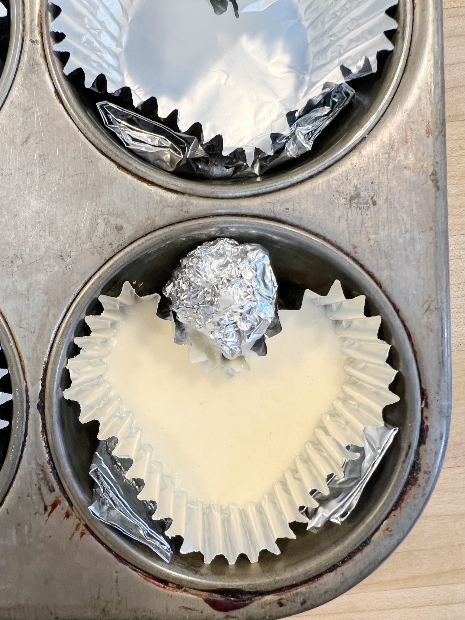 muffin tin transformed to a heart muffin tin with foil
