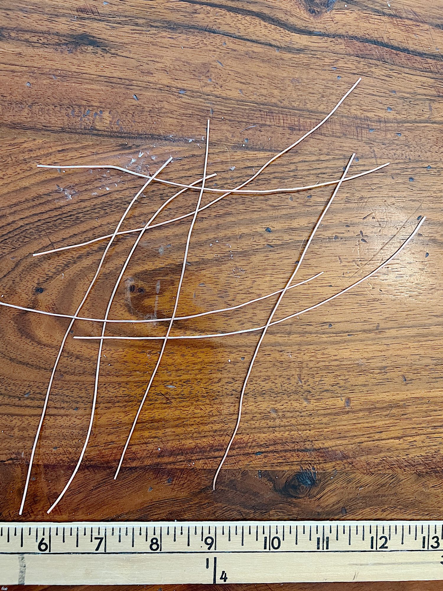 making copper wire hearts by twising copper wire with pliers