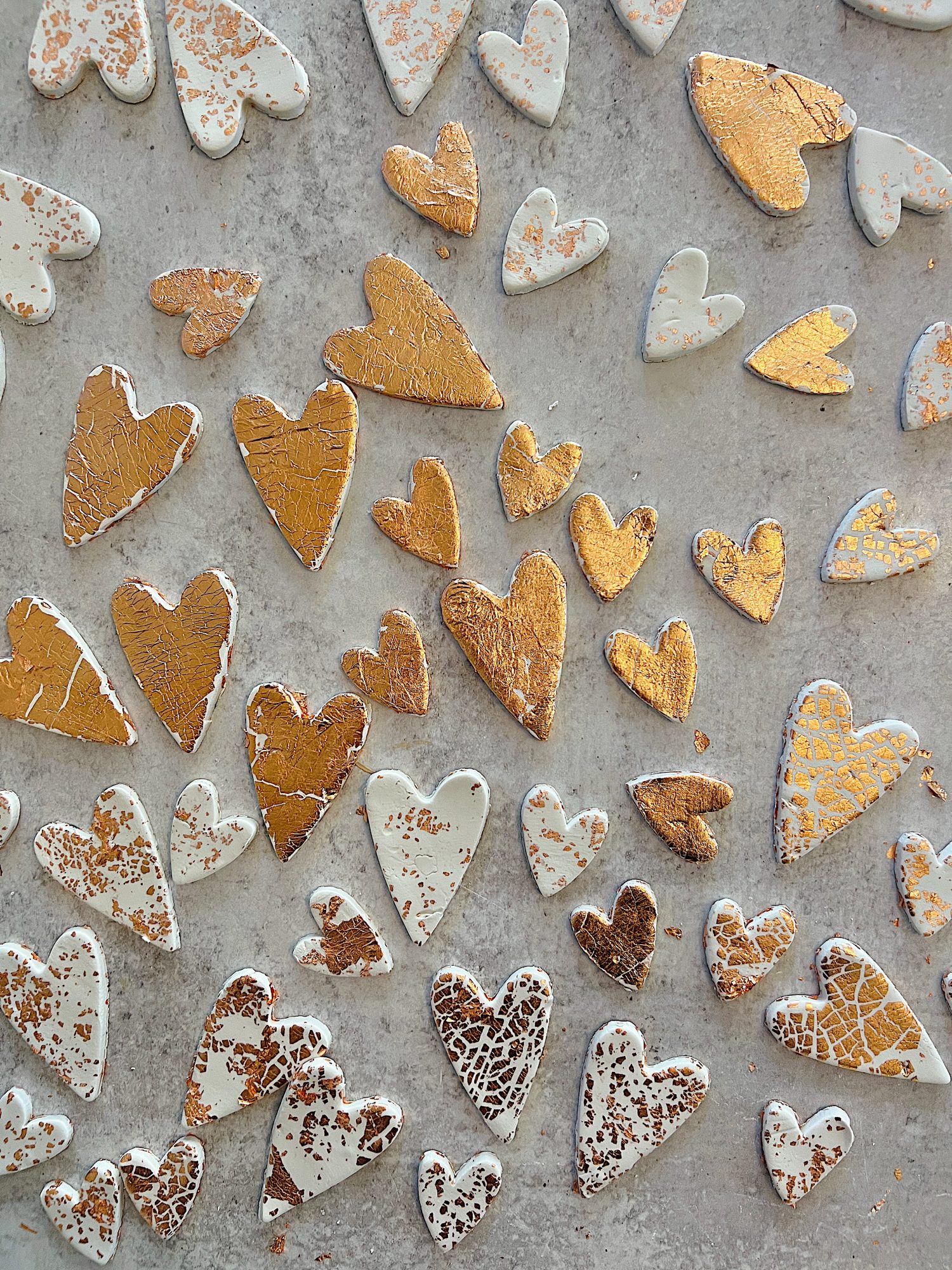 white clay hearts made from air dry clay, copper foil and a heart shaped cookie cutter