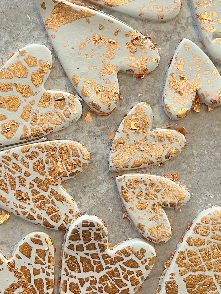 white clay hearts made from air dry clay, copper foil and a heart shaped cookie cutter