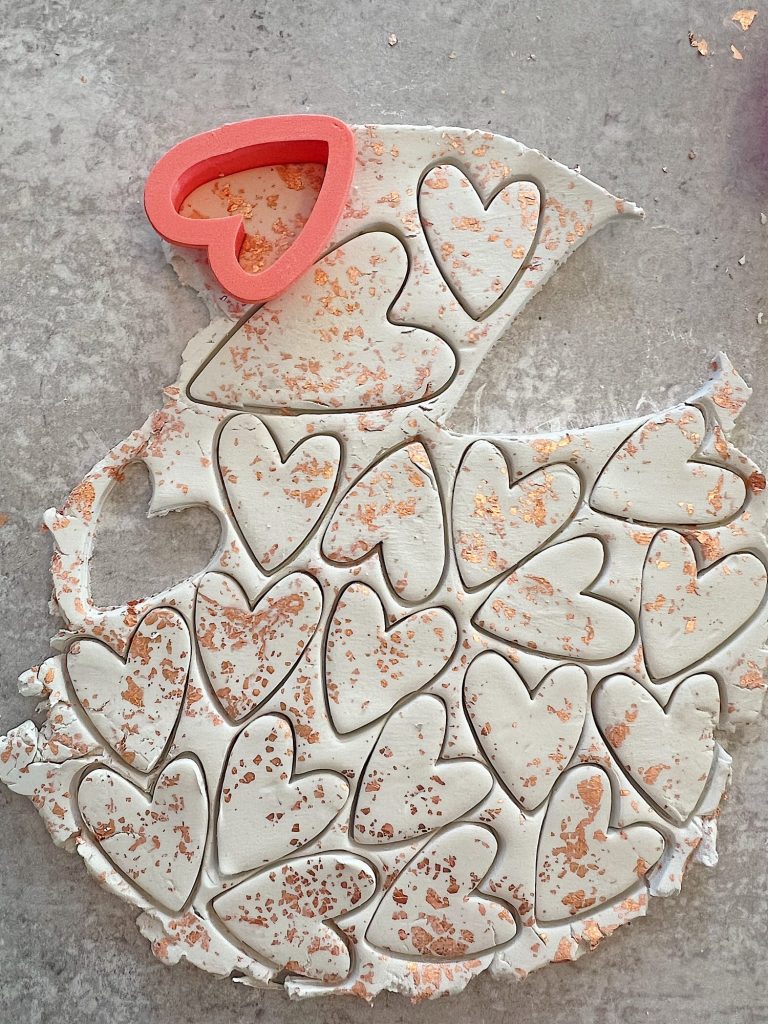 white clay hearts made from air dry clay, copper foil and a heart shaped cookie cutter