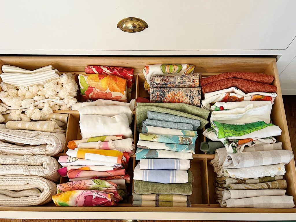 drawer filled with assorted pillow covers