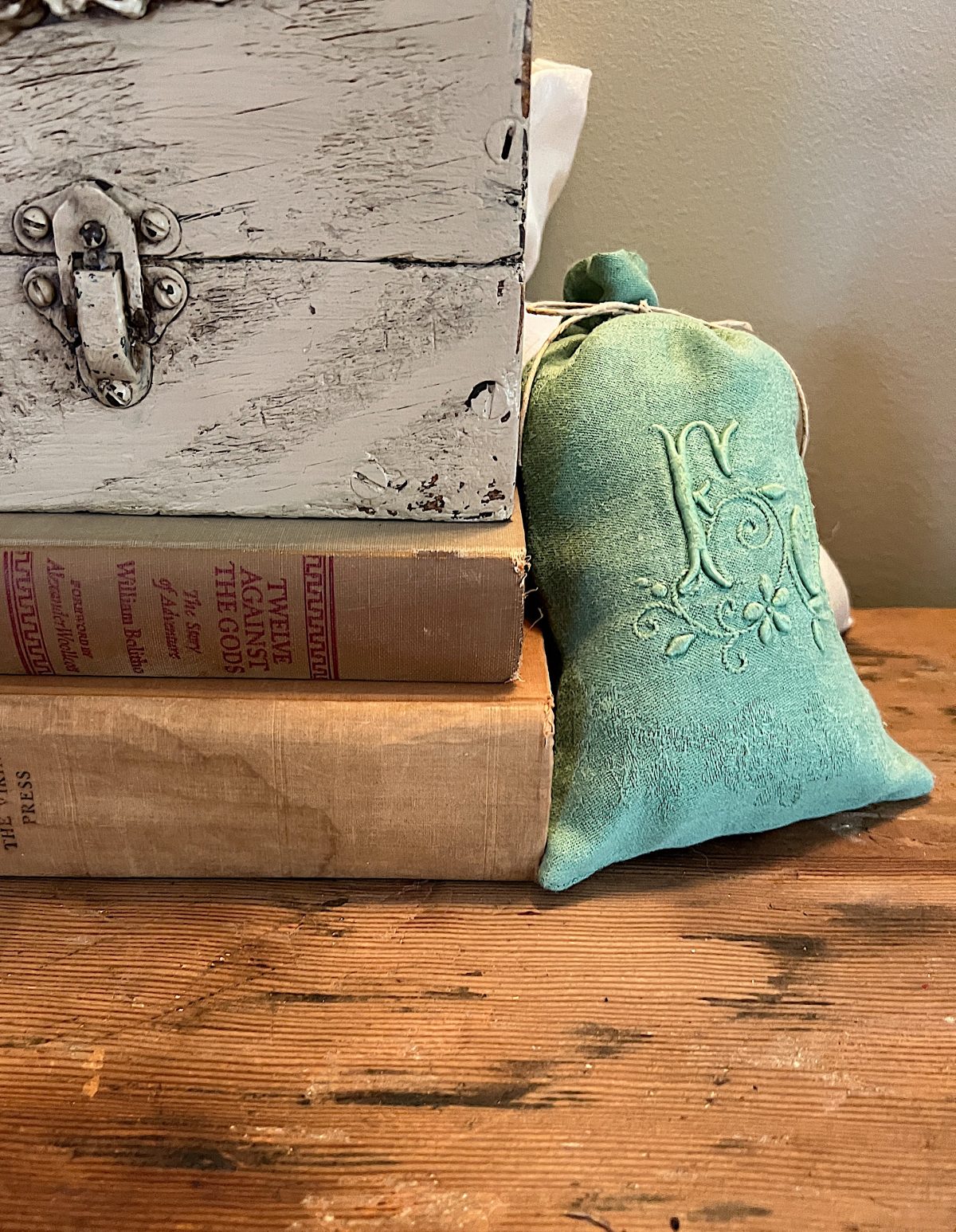 books and a lavender sachet in sage and green