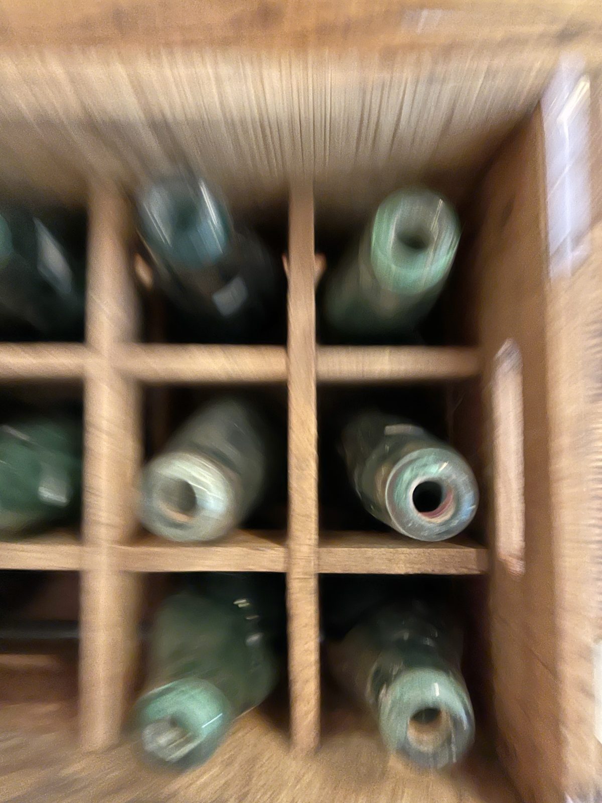 vintage crate with bottles in sage and green