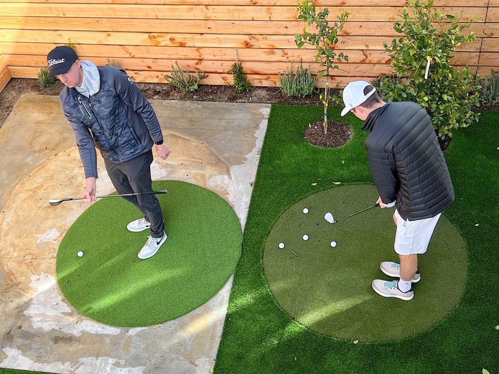 Matt and Michael chipping on the putting green in our back yard.