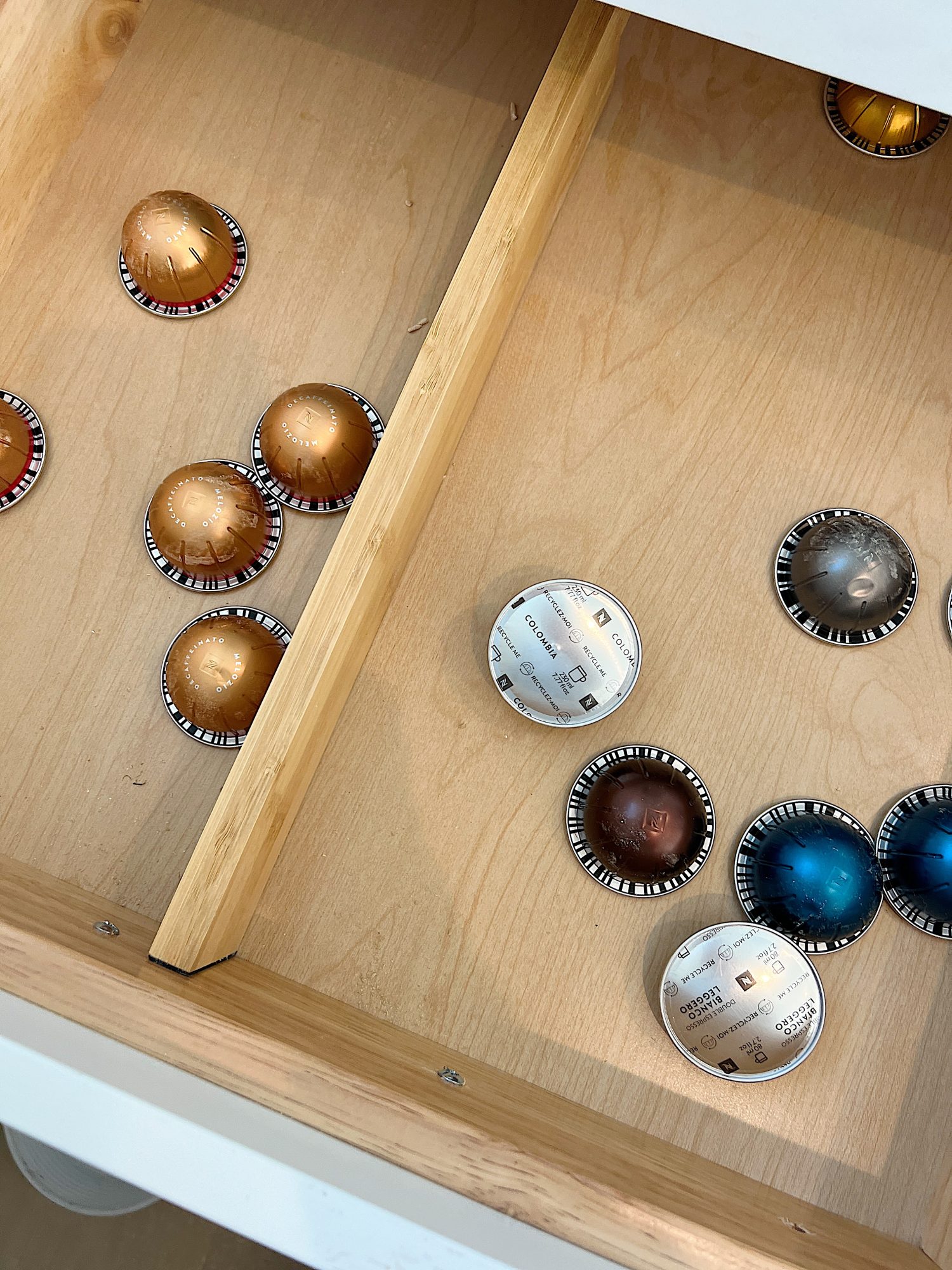 Drawer with wooden separator and Nespresso Cafe pods