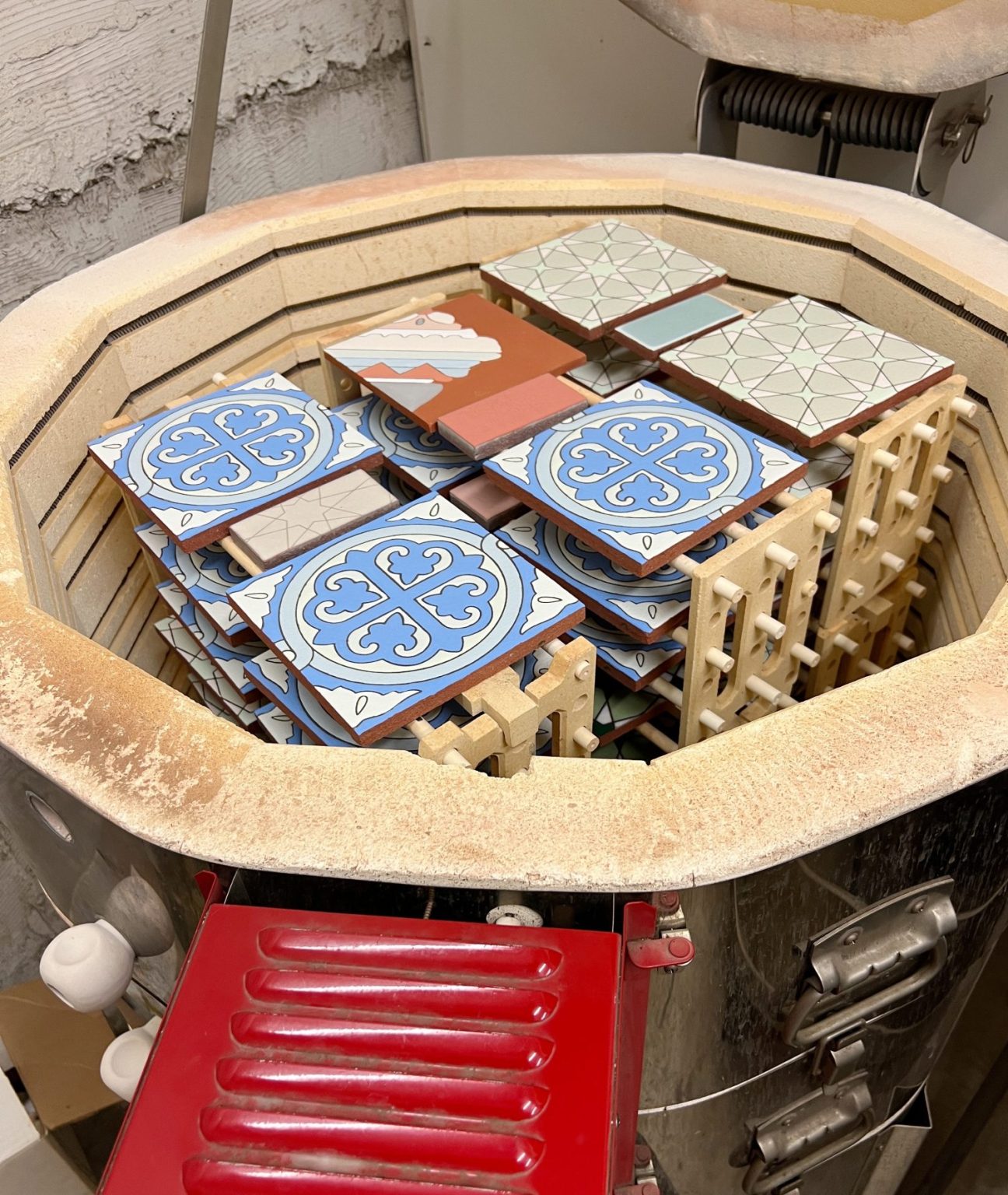 a pottery kiln with hand painted tiles inside