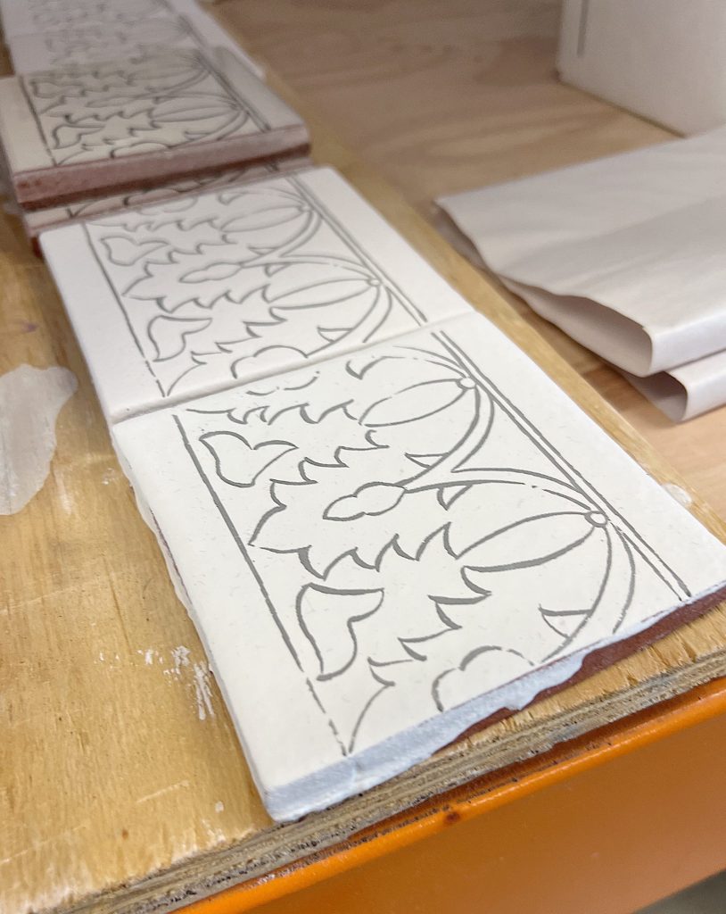 tiles with an outline for an artist to make hand painted tiles
