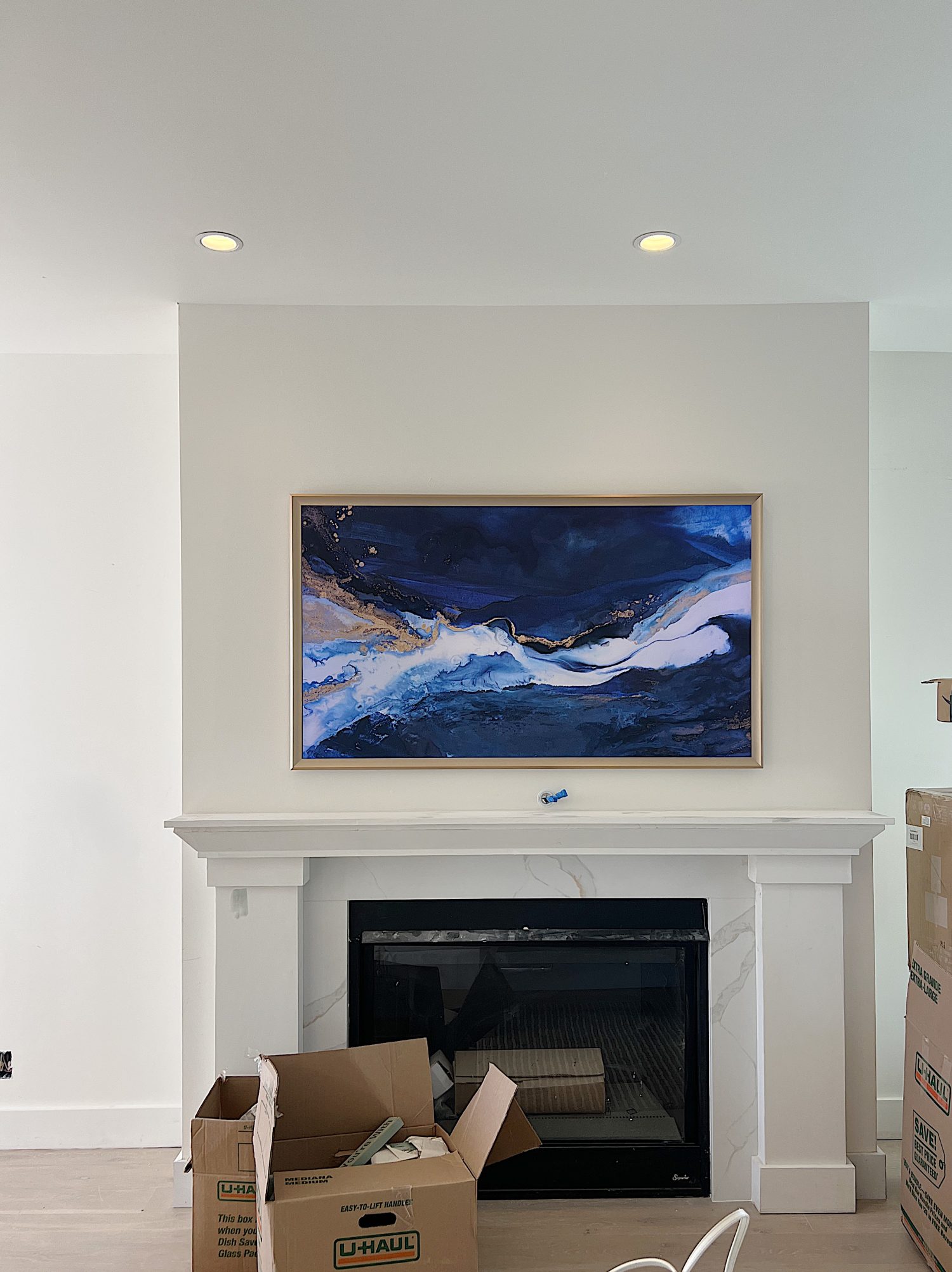 New mantle, fireplace, and FrameTV in the family living are of our newly remodeled beach house.