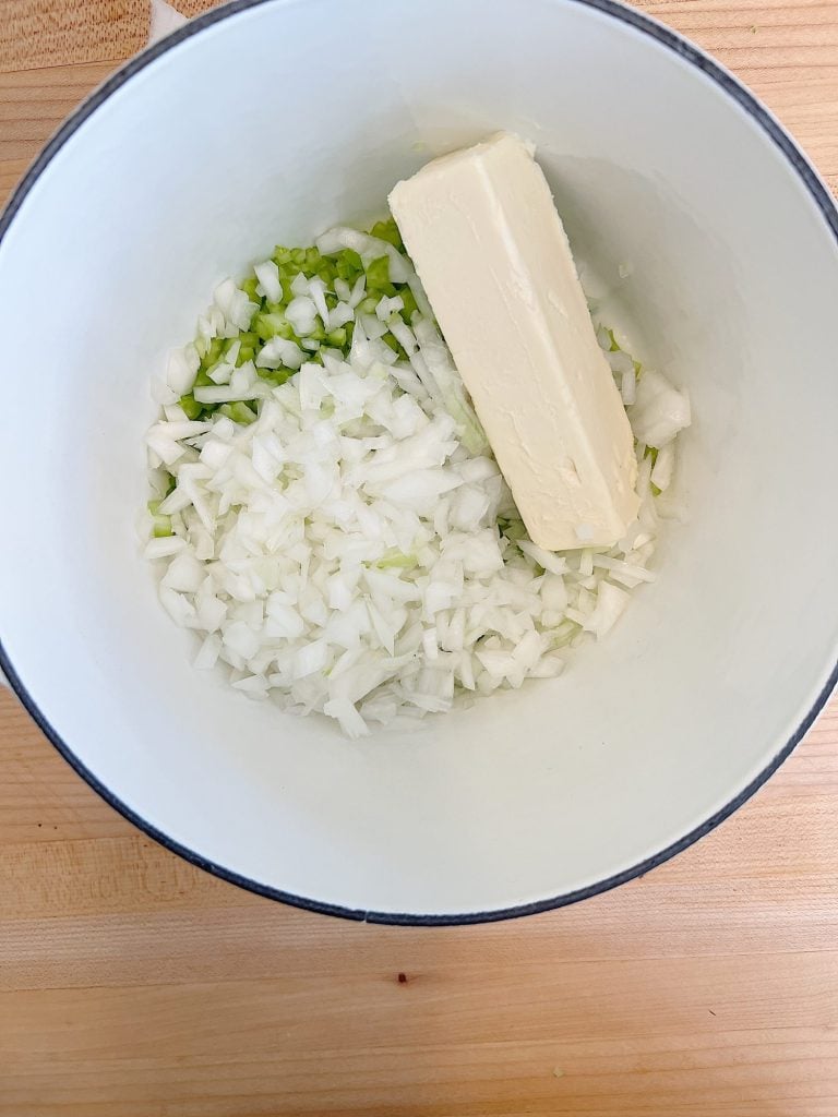 butter and chopped onions and chopped celery in a sauce pan.