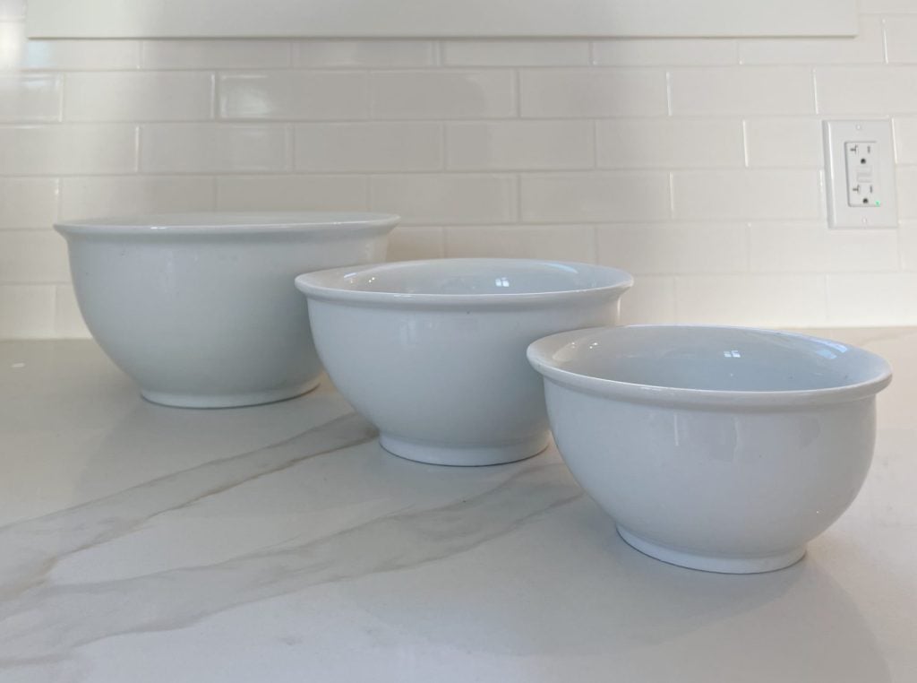 three white ceramic mixing bowls