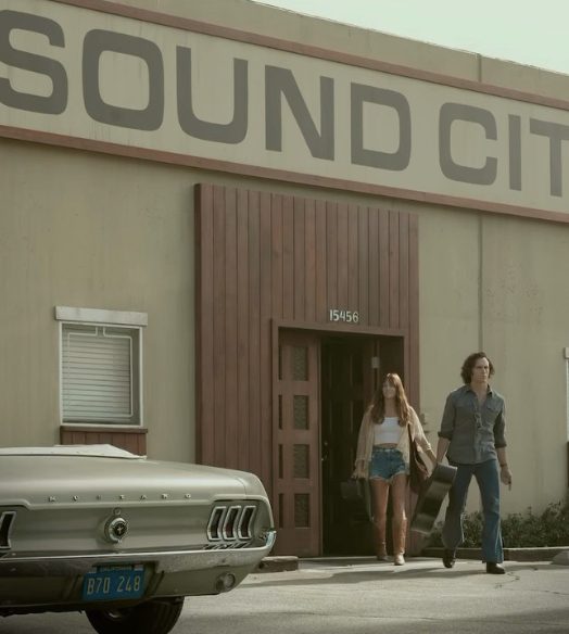 Sound City recording studio with 1960s convertible mustang in front, Daisy Jones and Billy exiting the building