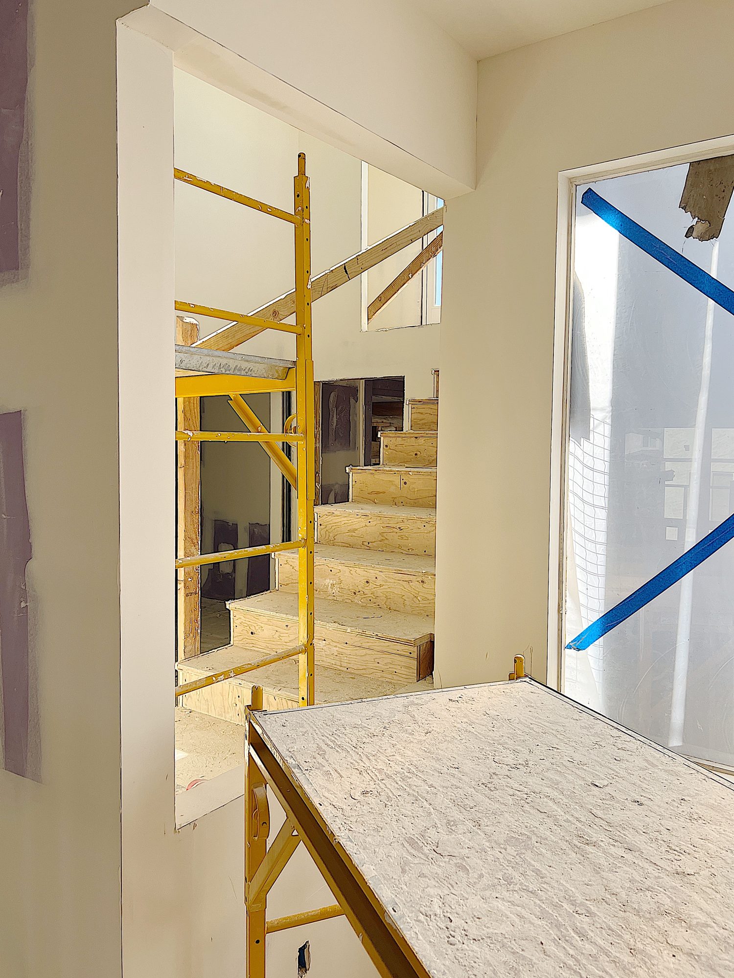 An opening in the wall in a staircase remodel
