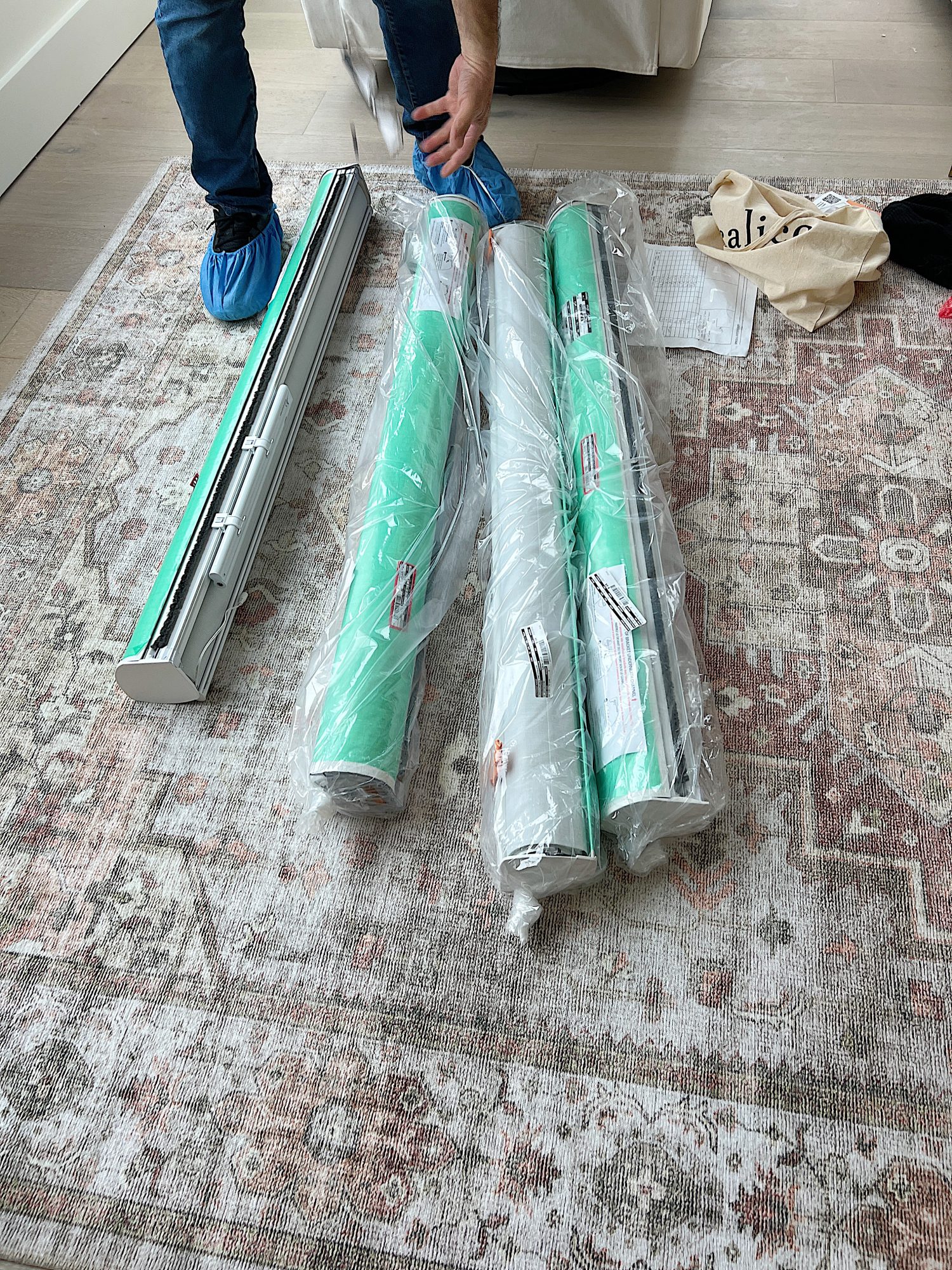 Installation of the blinds in our primary bedroom in our beach house with five windows and an ocean view.