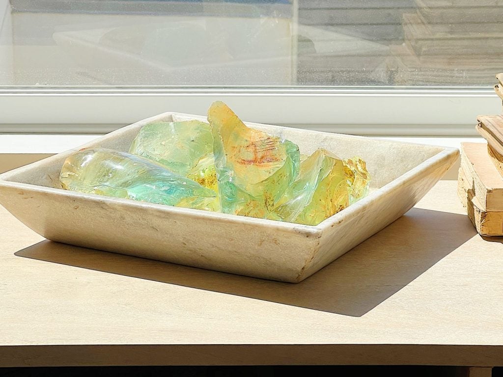 a vintage marble container filled with old glass from a windshield factory.