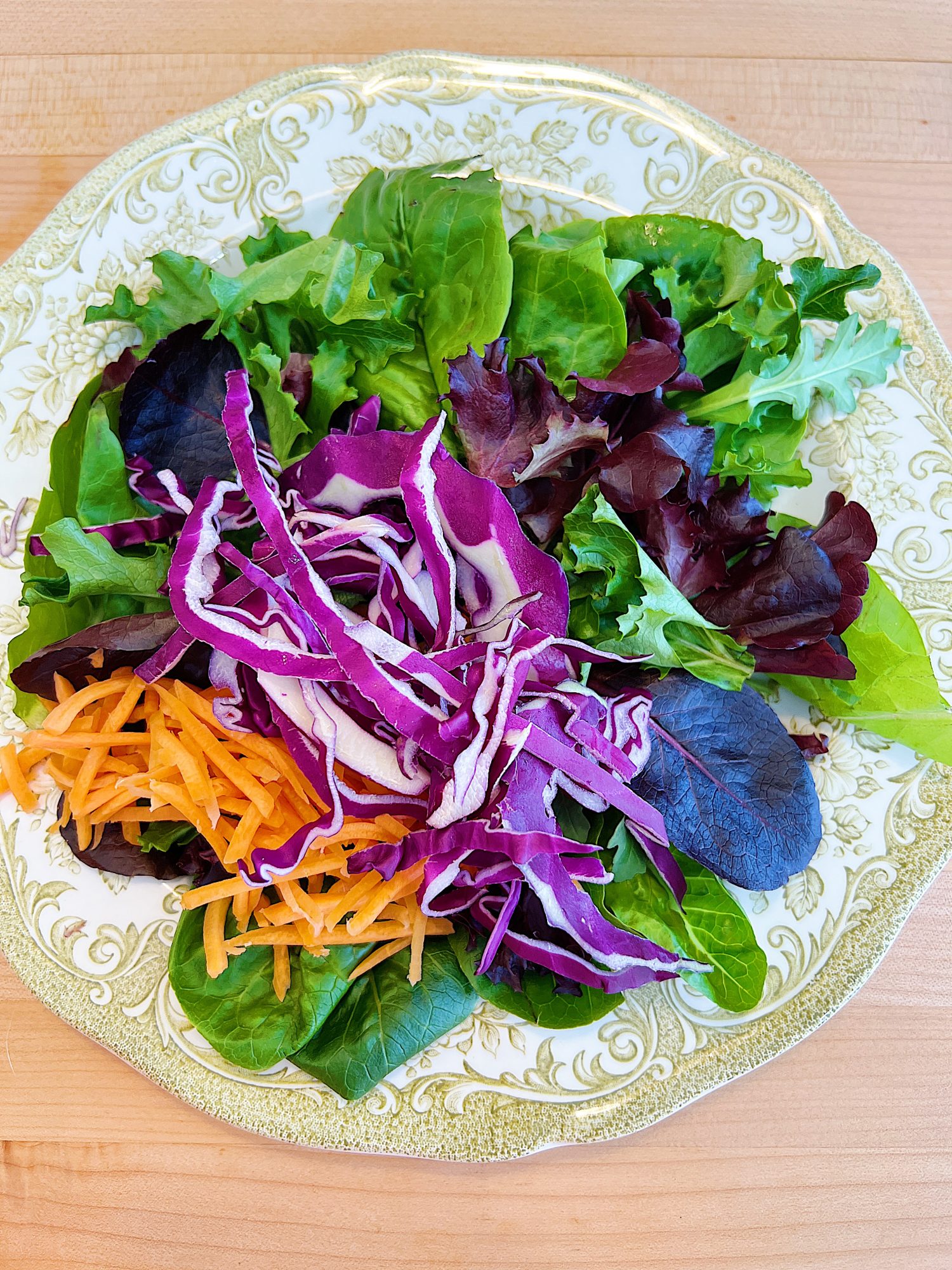 Spring Salad Recipe with Spice-Rubbed Salmon, mixed greens, tomatoes, avocados, cabbage, carrots, corn, and cilantro dressing.
