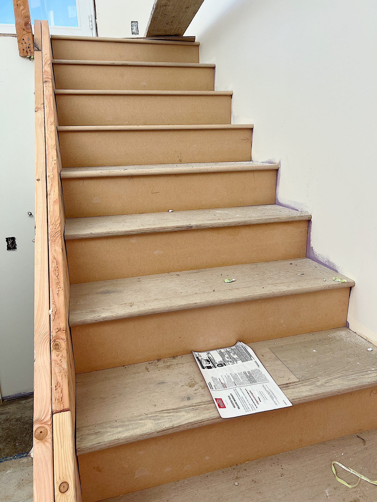 A flooring remodel used the existing hardwood floors and new engineered hardwood.